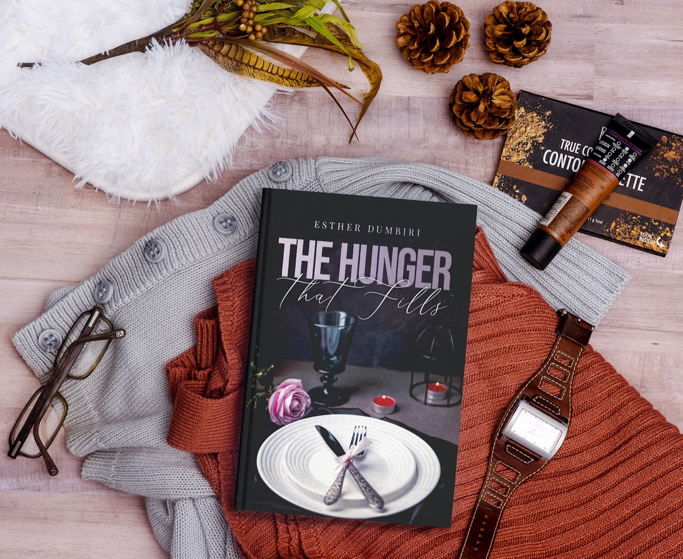 The Hunger That Fills laid out with reading glasses and a warm sweater